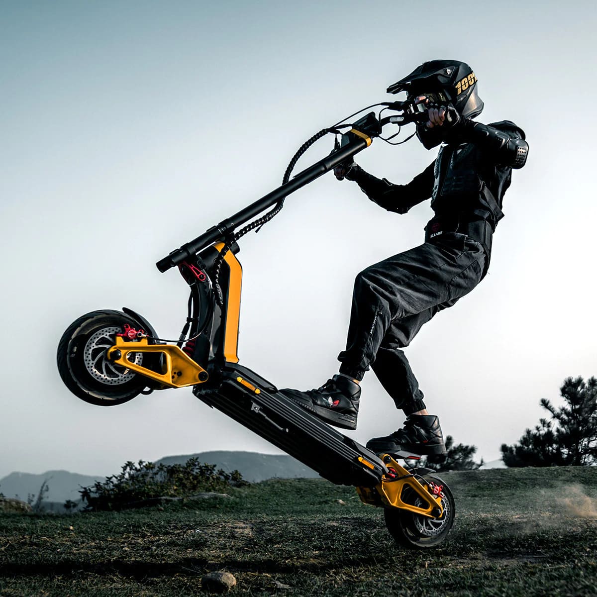 Rider using an INMOTION electric scooter with protective equipment